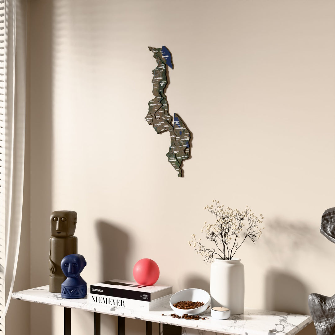 Satellite Malawi wooden wall map beside a sheer curtain, angled view