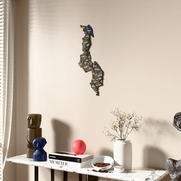 Satellite Malawi wooden wall map beside a sheer curtain, angled view