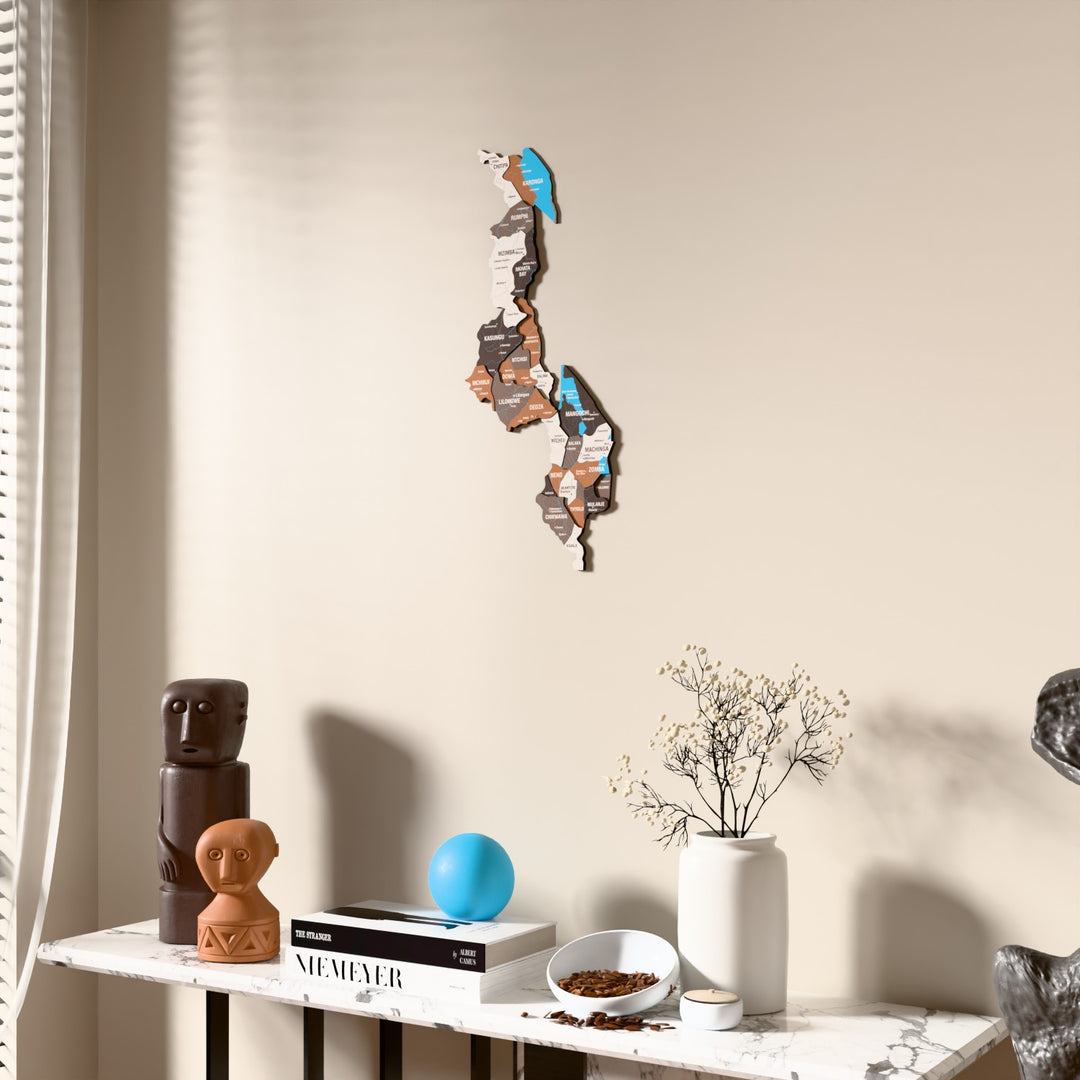 Soil Malawi wooden wall map beside a sheer curtain, angled view