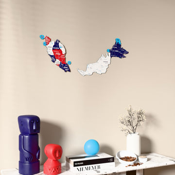 Flag colored Malaysia wooden wall map on a beige wall above a console with figurines