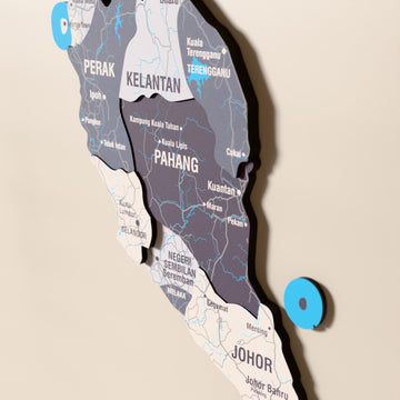 Close-up of the Nimbus Malaysia wooden wall map with layered regions and printed names