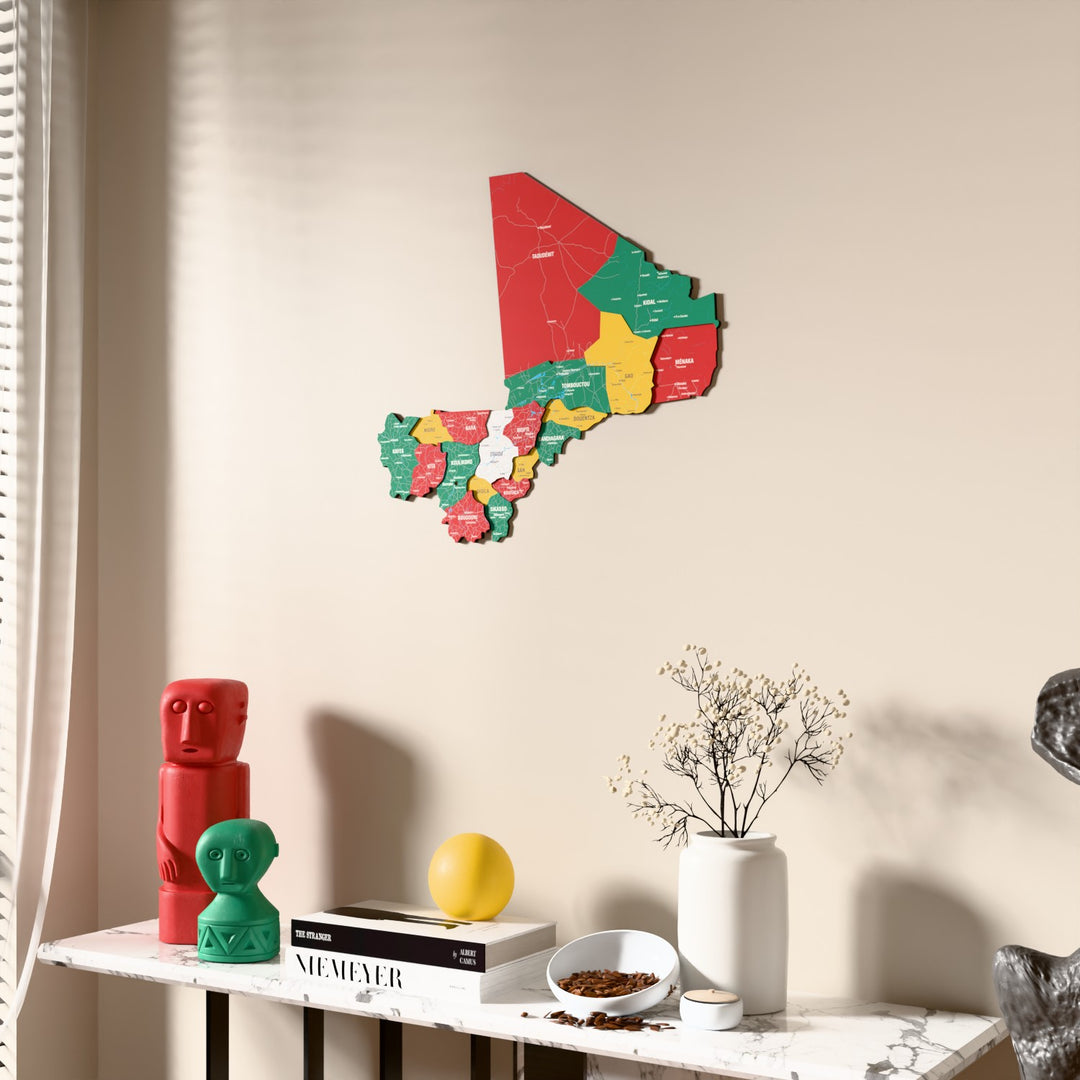 Flag colored Mali wooden wall map beside a sheer curtain, angled view