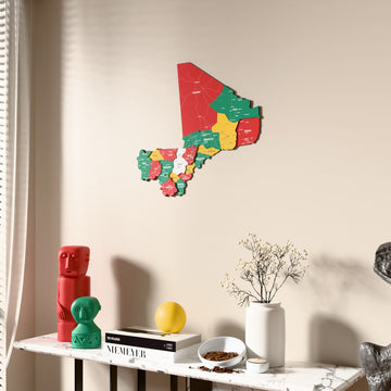 Flag colored Mali wooden wall map beside a sheer curtain, angled view