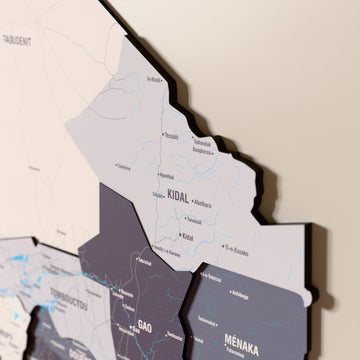 Close-up of the Nimbus Mali wooden wall map with layered regions and printed names