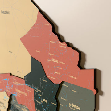 Close-up of the Sage Mali wooden wall map with layered regions and printed names