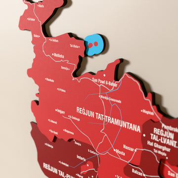 Close-up of the Flag colored Malta wooden wall map with layered regions and printed names