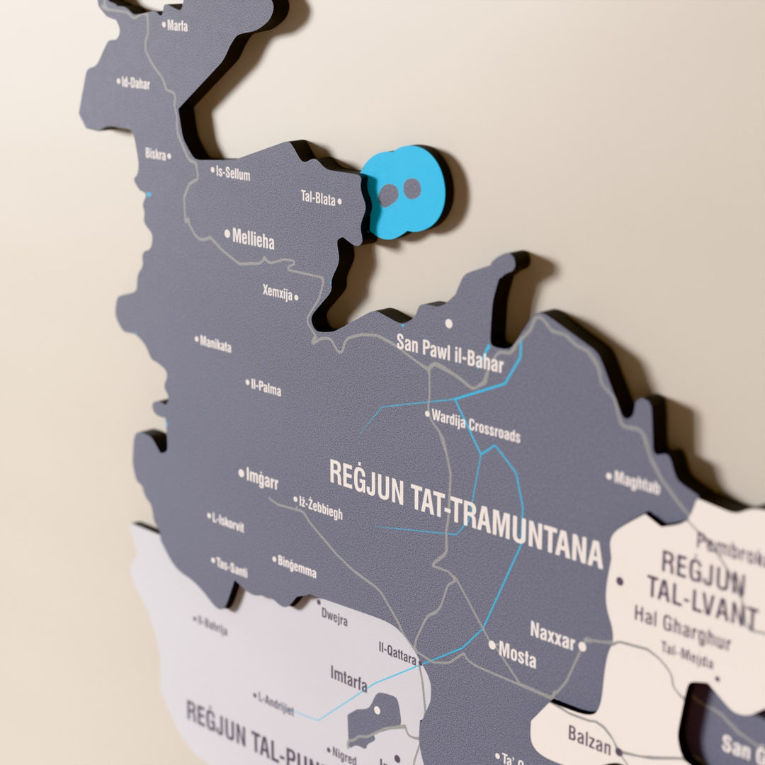 Close-up of the Nimbus Malta wooden wall map with layered regions and printed names