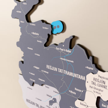 Close-up of the Nimbus Malta wooden wall map with layered regions and printed names