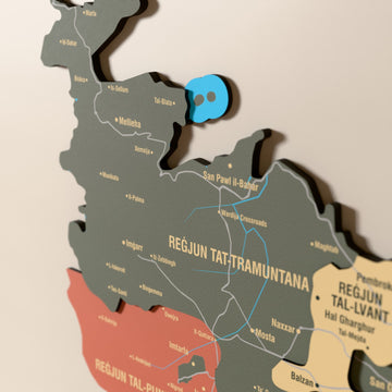 Close-up of the Sage Malta wooden wall map with layered regions and printed names
