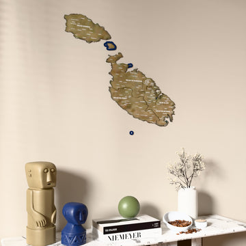 Satellite Malta wooden wall map on a beige wall above a console with figurines