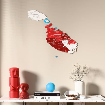 Flag colored Malta wooden wall map above a marble console, front view