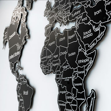 Close-up of Africa and the Middle East with country names on the black metal world map