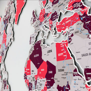 Close-up of Algeria, Libya, Egypt and Sudan on the crimson metal world map