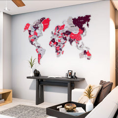 Crimson metal world map above a dark console table in a living room corner, wide view