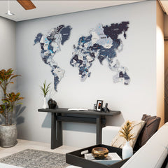 Nimbus metal world map in gray and mauve tones on a light wall above a dark console, wide living room view
