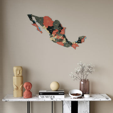 Sage Mexico wooden wall map in dark green, tan and salmon states above a marble console table, front view