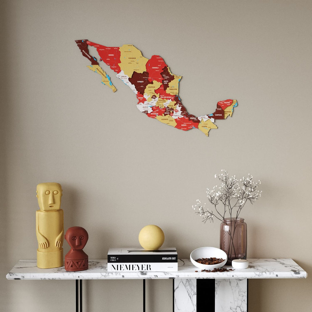 Terra Mexico wooden wall map in red, maroon and mustard states above a marble console table, front view