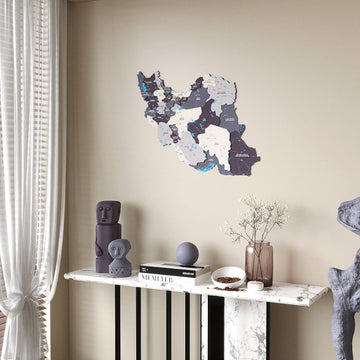 Nimbus Iran wooden wall map, far view beside a white curtain above a marble console shelf