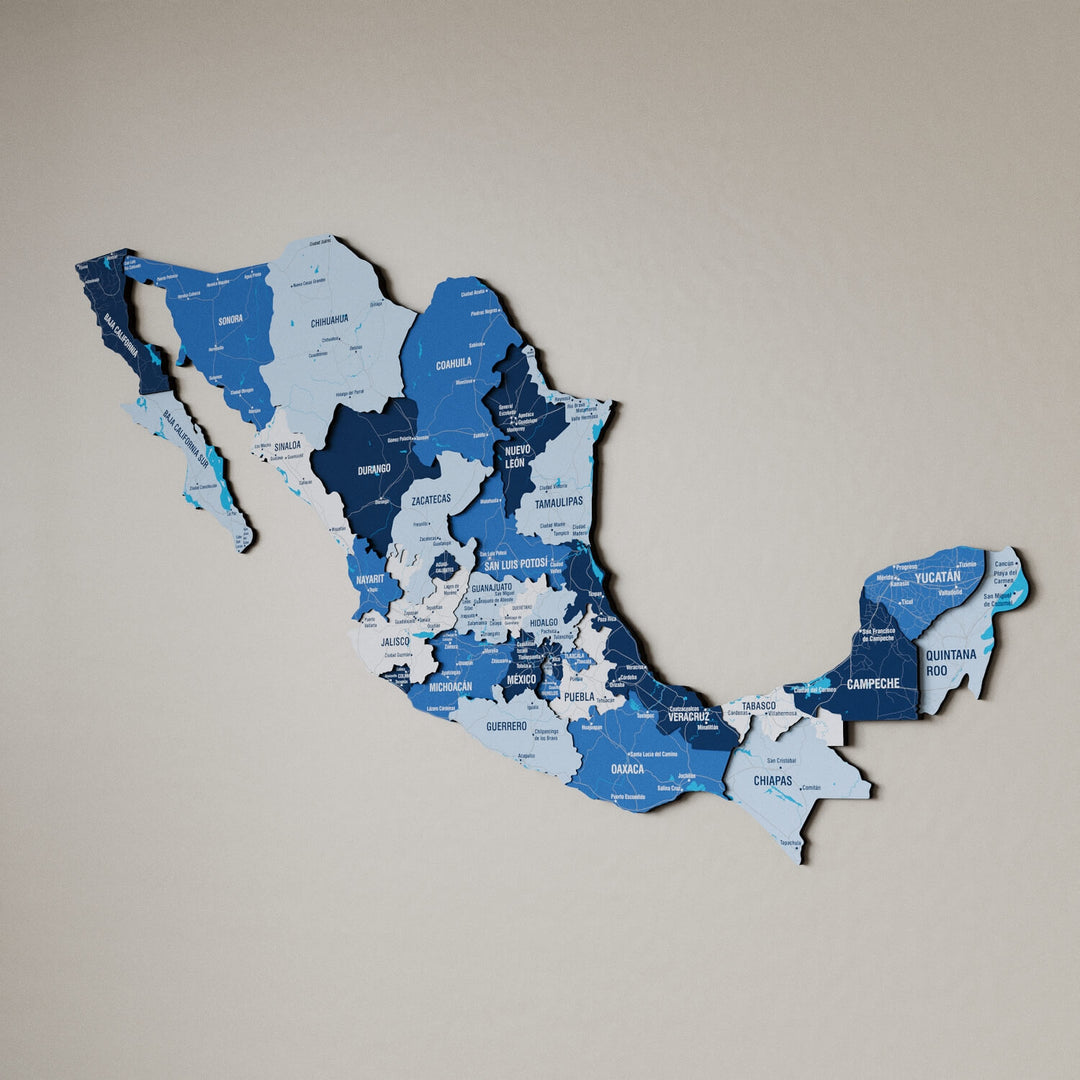 Navy Mexico wooden wall map in shades of blue on a beige wall, angled view showing the layered pieces