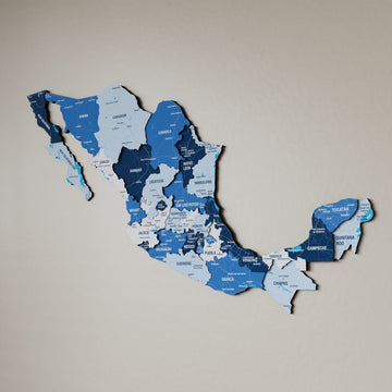 Navy Mexico wooden wall map in shades of blue on a beige wall, angled view showing the layered pieces