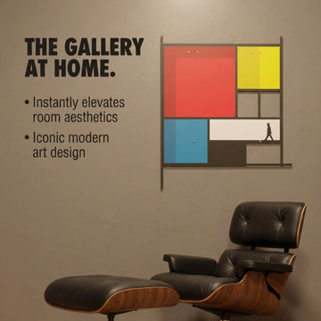 Mondrian-style metal wall art above a leather lounge chair: The Gallery at Home