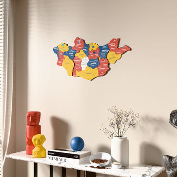 Flag colored Mongolia wooden wall map beside a sheer curtain, angled view