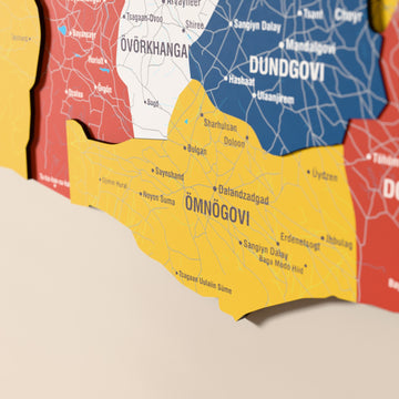 Close-up of the Flag colored Mongolia wooden wall map with layered regions and printed names