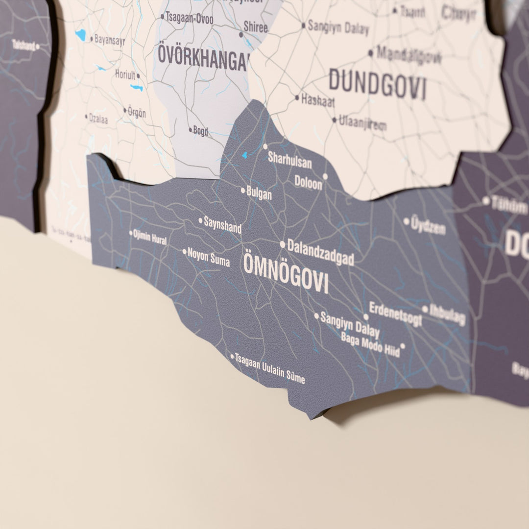 Close-up of the Nimbus Mongolia wooden wall map with layered regions and printed names
