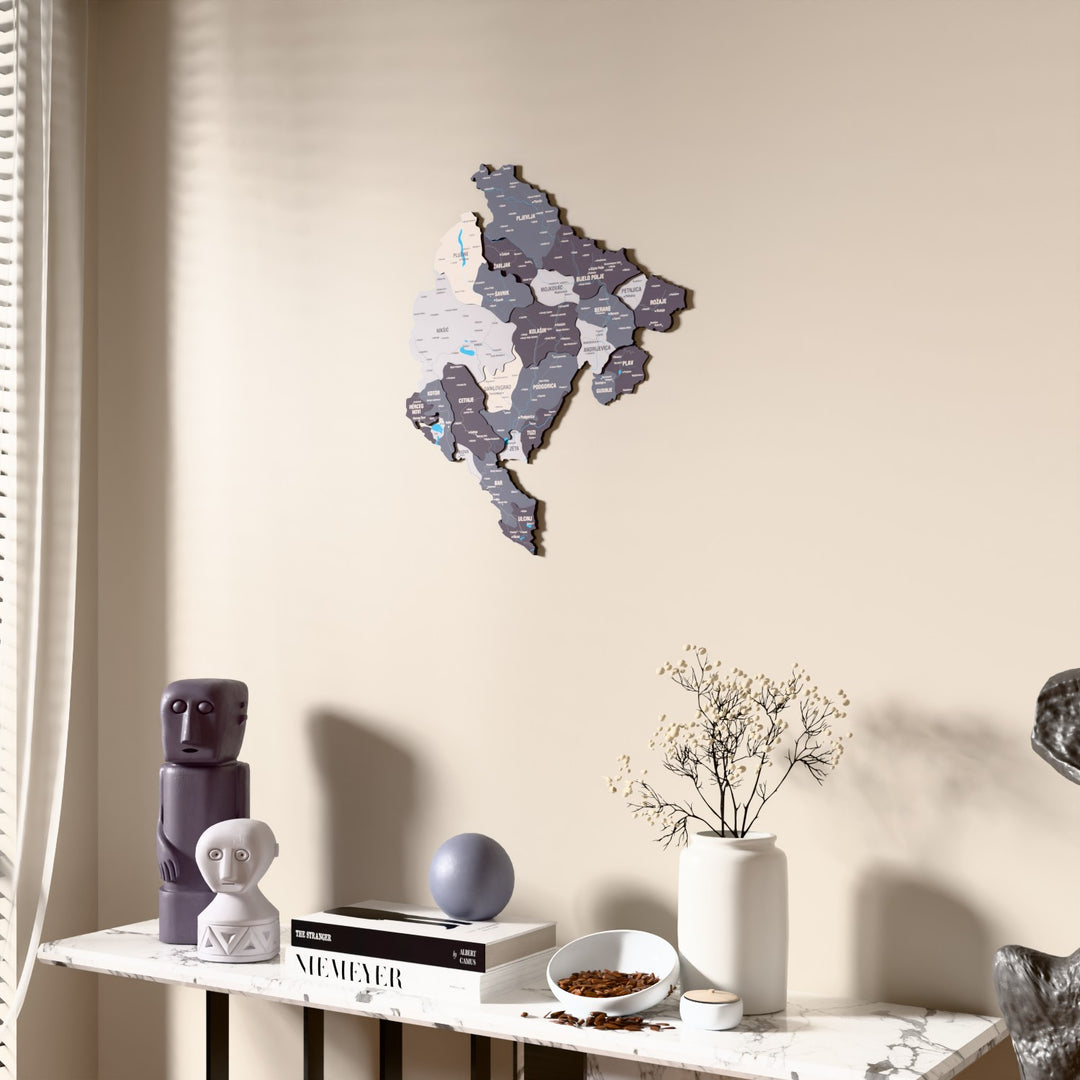 Nimbus Montenegro wooden wall map beside a sheer curtain, angled view