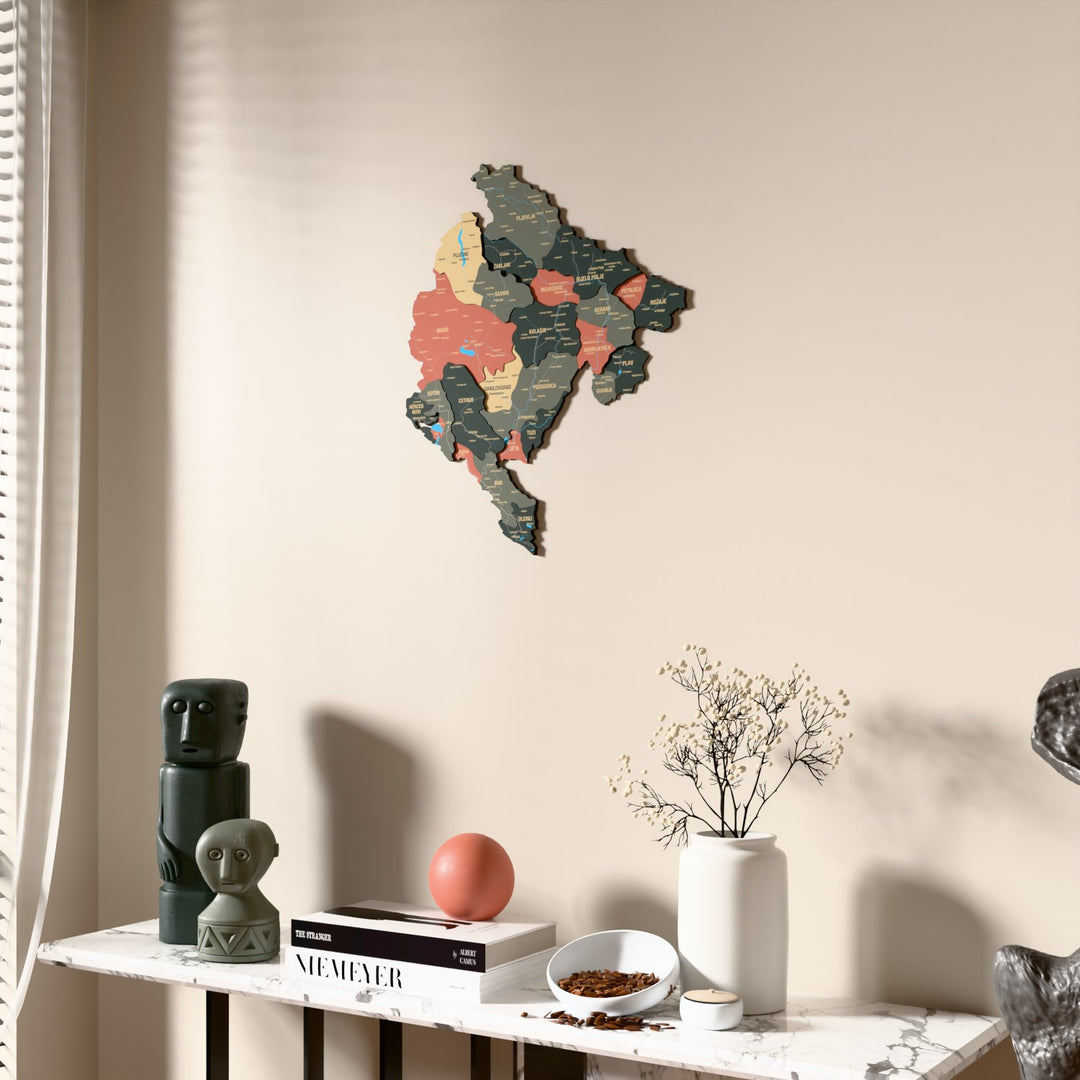 Sage Montenegro wooden wall map beside a sheer curtain, angled view