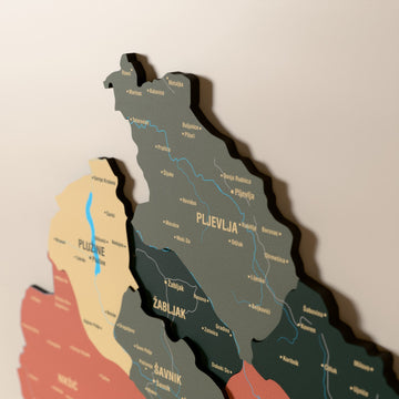 Close-up of the Sage Montenegro wooden wall map with layered regions and printed names
