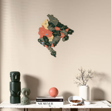 Sage Montenegro wooden wall map above a marble console, front view