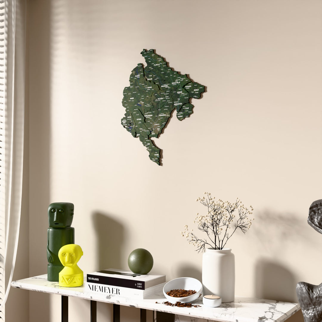 Satellite Montenegro wooden wall map beside a sheer curtain, angled view