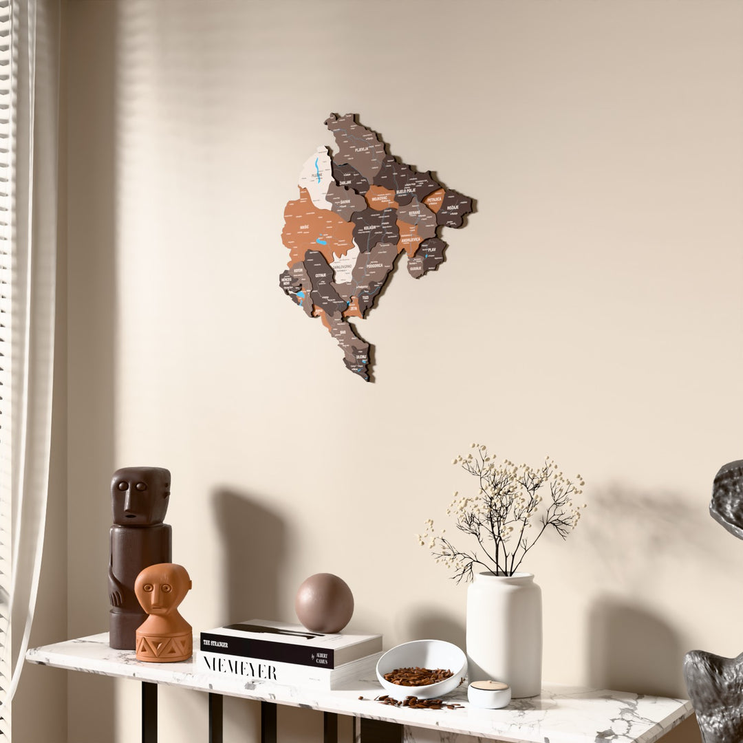 Soil Montenegro wooden wall map beside a sheer curtain, angled view
