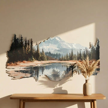 Close-up of the mountain and forest metal art with a vase of dried grass