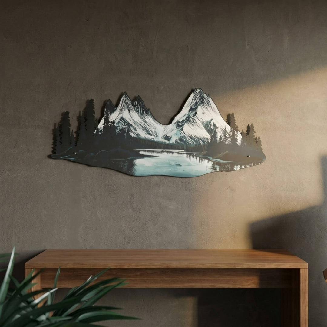 Mountain and river UV printed metal wall art with twin snowy peaks above a wooden console