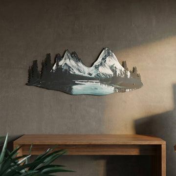 Mountain and river UV printed metal wall art with twin snowy peaks above a wooden console