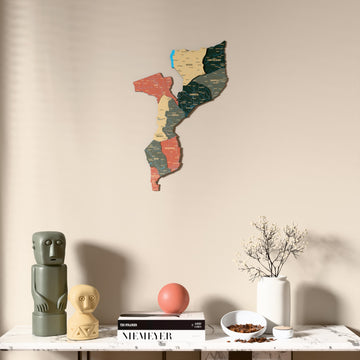 Sage Mozambique wooden wall map above a marble console, front view