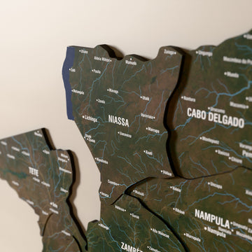 Close-up of the Satellite Mozambique wooden wall map with layered regions and printed names