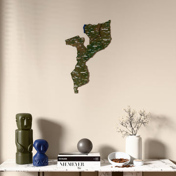 Satellite Mozambique wooden wall map above a marble console, front view