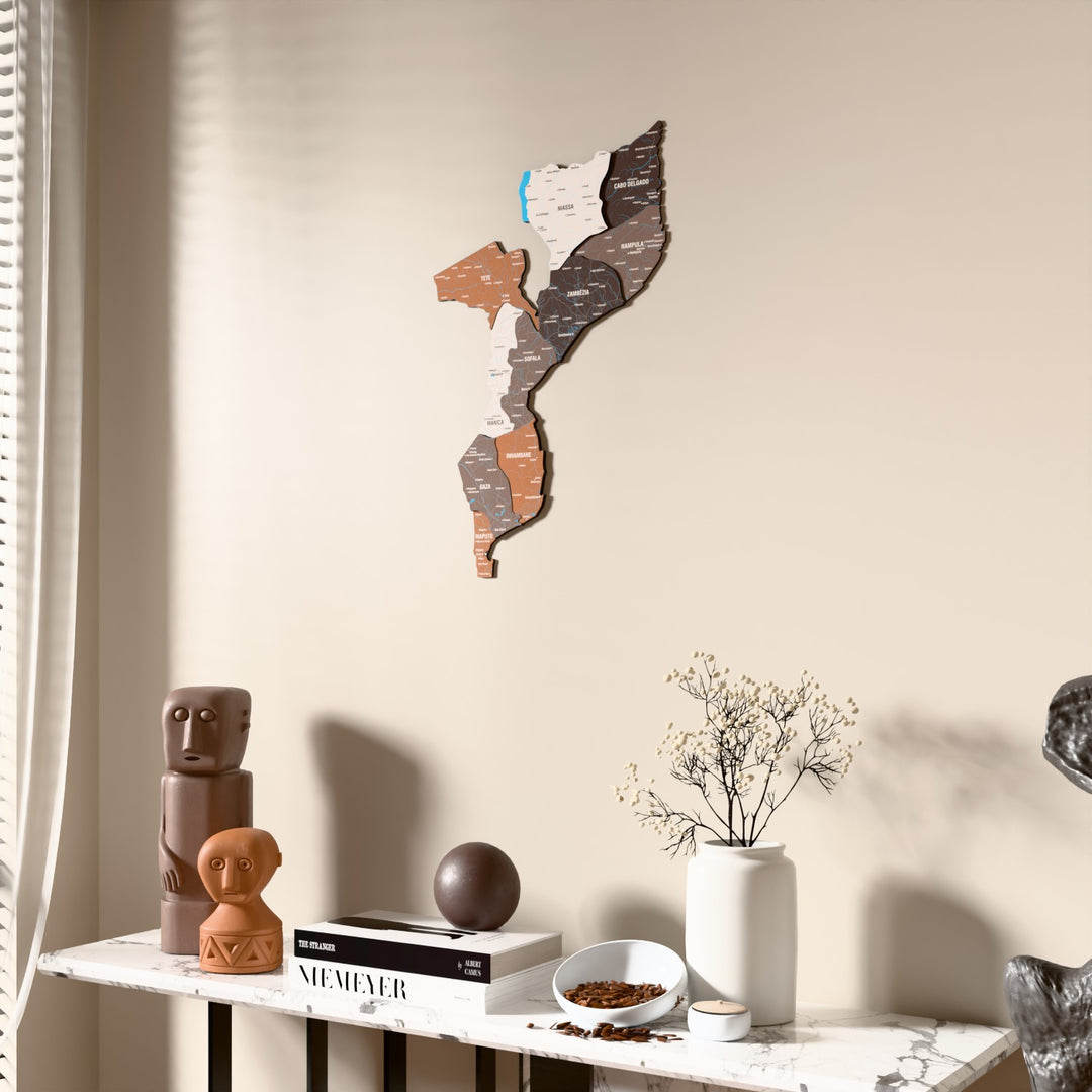 Soil Mozambique wooden wall map beside a sheer curtain, angled view