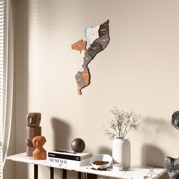 Soil Mozambique wooden wall map beside a sheer curtain, angled view