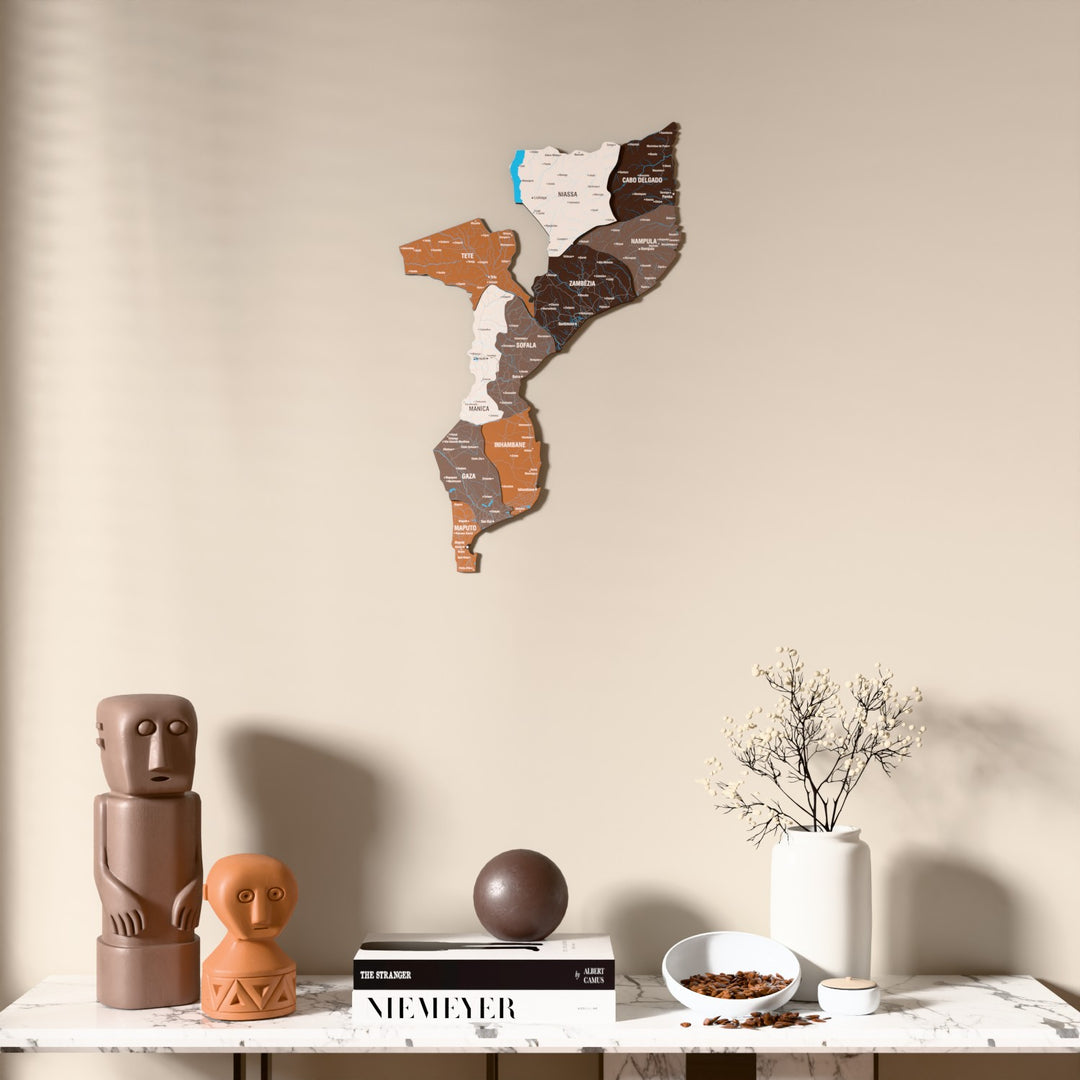 Soil Mozambique wooden wall map above a marble console, front view