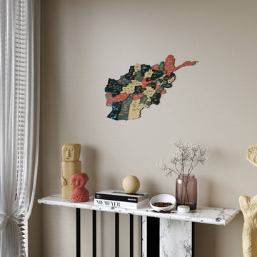Sage Afghanistan wooden map with dark green and tan provinces above a console, curtain at the left