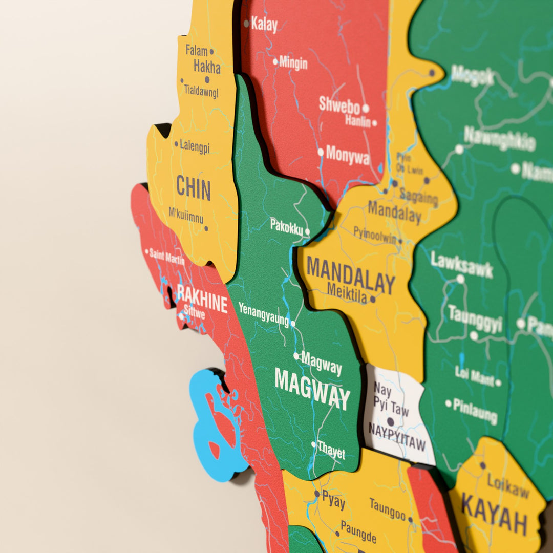 Close-up of the Flag colored Myanmar wooden wall map with layered regions and printed names