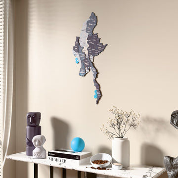 Nimbus Myanmar wooden wall map beside a sheer curtain, angled view