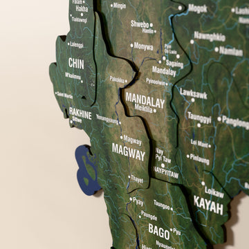 Close-up of the Satellite Myanmar wooden wall map with layered regions and printed names