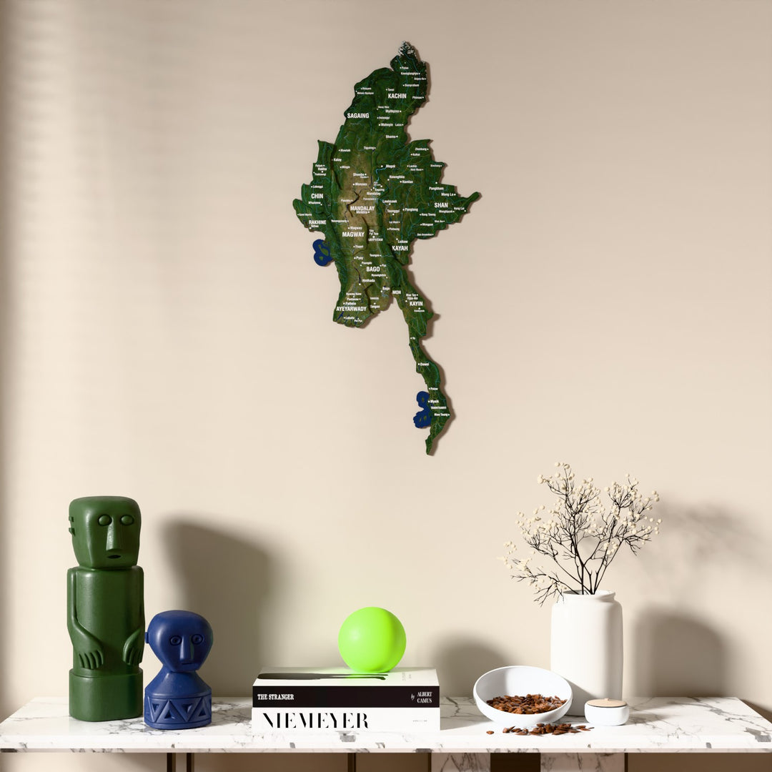 Satellite Myanmar wooden wall map above a marble console, front view