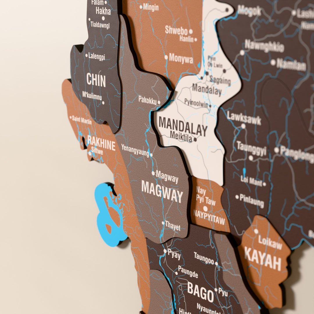 Close-up of the Soil Myanmar wooden wall map with layered regions and printed names