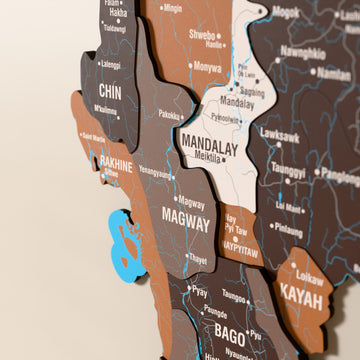 Close-up of the Soil Myanmar wooden wall map with layered regions and printed names